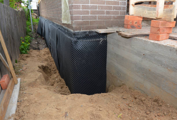 SJ Waterproofing Pros technician performing targeted Foundation Crack Repair assessment in Brownstown, IN